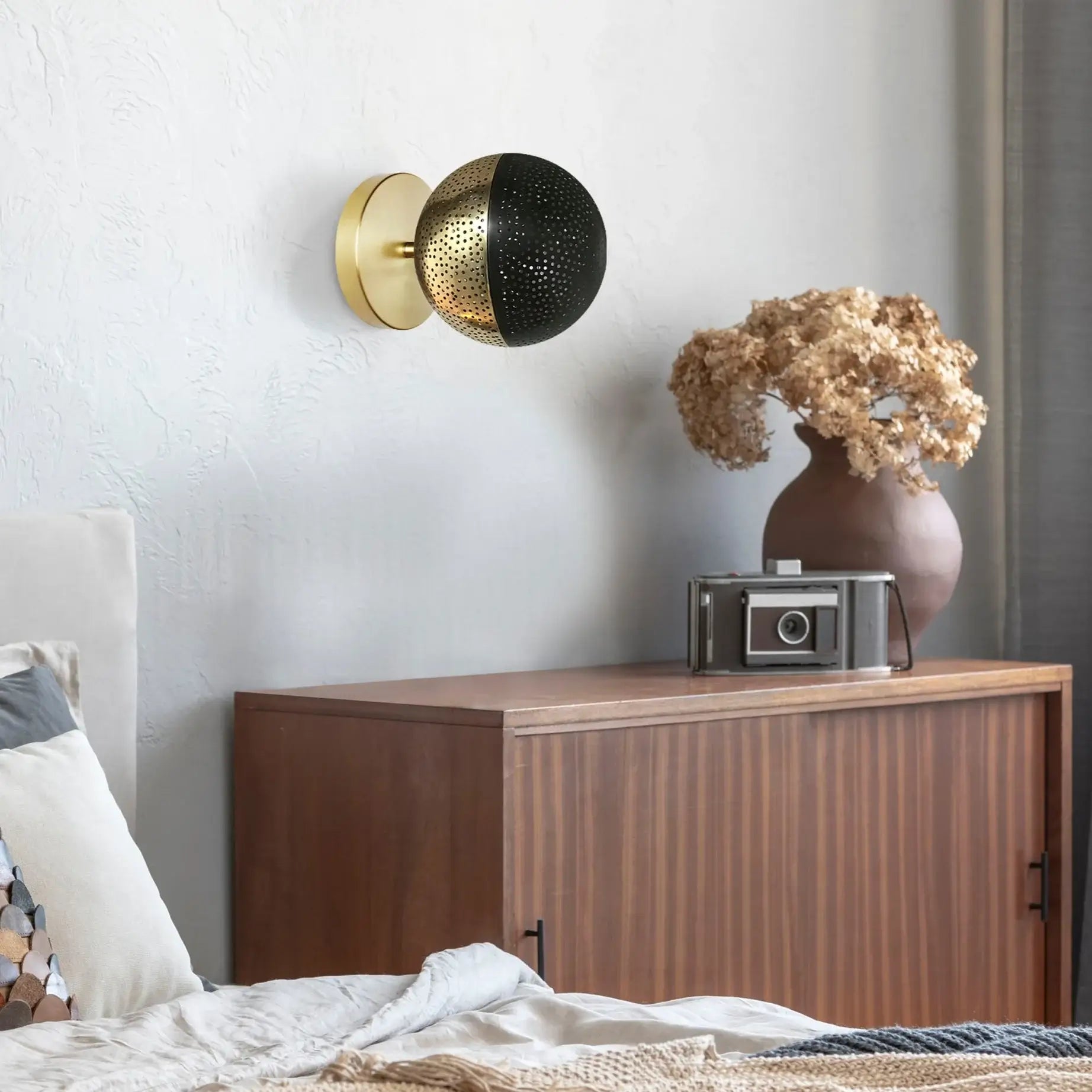 Dounia home Wall scone in Polished brass/black made of Metal, used as a bedroom lighting, Model: Kora